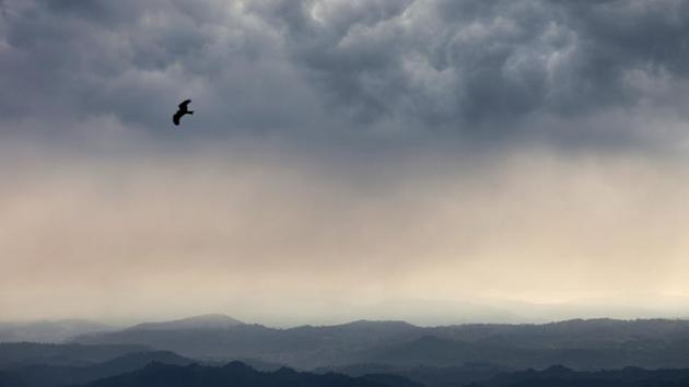 A kite flies as dark clouds gather over the Kangra valley in Dharmsala, Himachal Pradesh. (Ashwini Bhatia / AP) A kite flies as dark clouds gather over the Kangra valley in Dharmsala, Himachal Pradesh. (Ashwini Bhatia / AP)