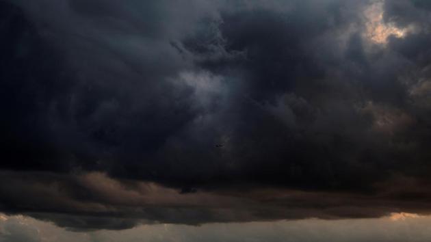 A plane (C) climbing into a cloud formation after taking off from Malta International Airport is seen from Sliema, Malta. (Darrin Zammit Lupi / REUTERS)