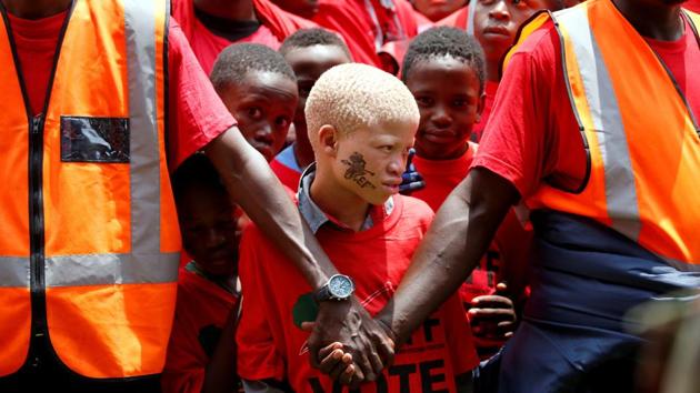 Marshals keeps watch over supporters of South Africa’s radical left-wing party, the Economic Freedom Fighters (EFF), ahead of the launch of the party’s election manifesto in Soshanguve, near Pretoria, South Africa. (Siphiwe Sibeko / REUTERS)