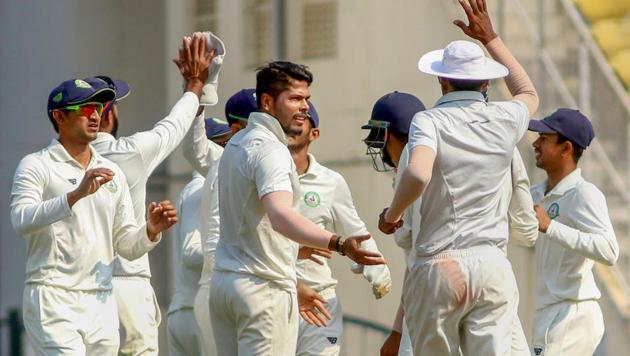 Vidarbha bowler Umesh Yadav celebrates with a teammate after taking a wicket of Saurashtra batsman Snell Patel during the third day of the Ranji Trophy Final cricket match, in Nagpur, Tuesday, Feb. 05, 2019(PTI)