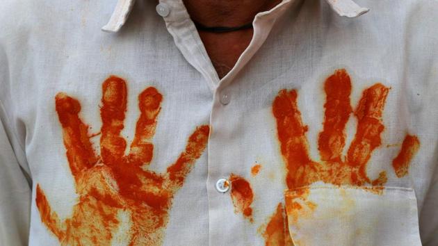 A devotee wears a shirt with turmeric handprints before a procession at shepherd god Khandoba’s temple during ‘Somvati Amavasya’ in Jejuri, Maharashtra. (Danish Siddiqui / REUTERS) A devotee wears a shirt with turmeric handprints before a procession at shepherd god Khandoba’s temple during ‘Somvati Amavasya’ in Jejuri, Maharashtra. (Danish Siddiqui / REUTERS)