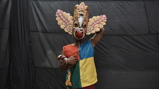 A member of the Sri Lankan Navy Dance Troupe poses for a photograph after getting ready at backstage to perform during the Sri Lanka Cultural Promenade organised by New Delhi Municipal Council (NDMC) in association with Sri Lanka High Commission, at Connaught Place, in New Delhi. (Burhaan Kinu / HT Photo) A member of the Sri Lankan Navy Dance Troupe poses for a photograph after getting ready at backstage to perform during the Sri Lanka Cultural Promenade organised by New Delhi Municipal Council (NDMC) in association with Sri Lanka High Commission, at Connaught Place, in New Delhi. (Burhaan Kinu / HT Photo)
