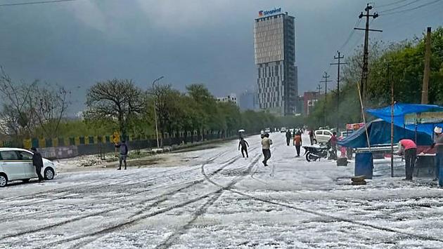 A view of a street after hailstorm struck various parts of Noida, Uttar Pradesh. (PTI) A view of a street after hailstorm struck various parts of Noida, Uttar Pradesh. (PTI)