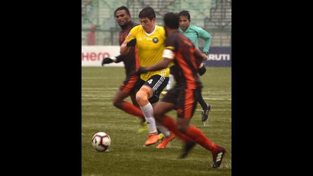 Real Kashmir’s Mason Robertson (C) runs with the ball. “I have struggled a lot. But whatever the situation, I try not to miss practice,” said Farooq, whose father was also a professional footballer for Mohammedan Sporting, one of India’s oldest clubs. “Playing in the I-League is a dream come true and I am living that dream every day.” Other players are also wary of the security situation and would rather join clubs outside of Kashmir. (Tauseef Mustafa / AFP)
