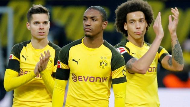 Barcelona's Ivan Rakitic, Axel Witsel and Julian Weigl look dejected at the end of the match.(REUTERS)