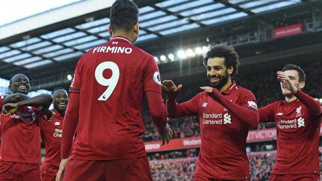 Mohamed Salah (2nd R) celebrates with teammates after scoring their third goal. (AFP) Mohamed Salah (2nd R) celebrates with teammates after scoring their third goal. (AFP)