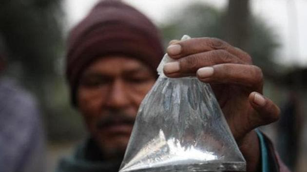A villager showing a packet of 'Hooch Pouch' at Magrahat in West Bengal, India (Hindustan Times file photo) A villager showing a packet of 'Hooch Pouch' at Magrahat in West Bengal, India (Hindustan Times file photo)