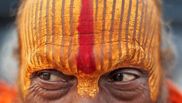 A seer stands on the banks of the river Ganga before taking a holy dip during Kumbh Mela in Prayagraj, Uttar Pradesh. (Adnan Abidi / REUTERS) A seer stands on the banks of the river Ganga before taking a holy dip during Kumbh Mela in Prayagraj, Uttar Pradesh. (Adnan Abidi / REUTERS)