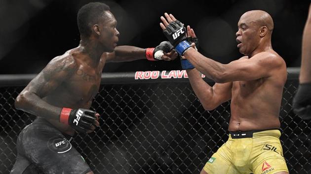Nigeria's Israel Adesanya, left, and Brazil's Anderson Silva fight during their middleweight bout at the UFC 234.(AP)
