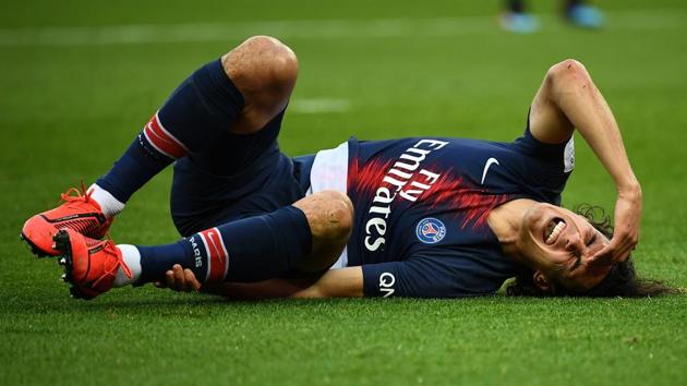 Edinson Cavani reacts after he gets an injury.(AFP)