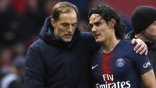 PSG coach Thomas Tuchel, left, speaks with PSG's Edinson Cavani as he leaves the pitch (AP) PSG coach Thomas Tuchel, left, speaks with PSG's Edinson Cavani as he leaves the pitch (AP)