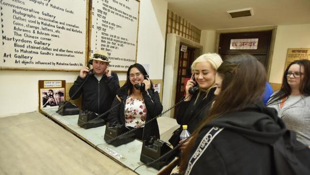 Tourists use old telephones during their visit to the Gandhi Museum. The Mahatma visited Delhi 80 times between 1915 and 1948, spending 720 days in the city, including the last 144 days of his life. His relationship with the city was recently chronicled in a book -- Gandhi’s Delhi -- by writer and journalist Vivek Shukla. (Sanjeev Verma / HT Photo)