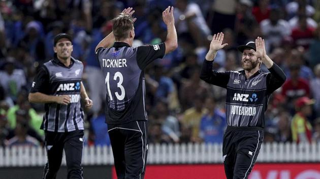 Blair Tickner, center, celebrates with Kane Williamson the wicket of India's Rishabh Pant. (AP)