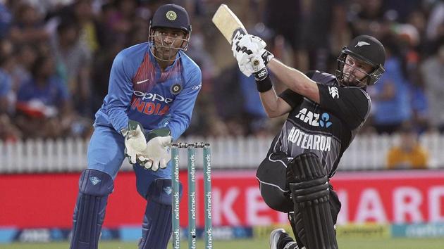 New Zealand's Colin Munro hits a four watched by India's wicketkeeper MS Dhoni. (AP)