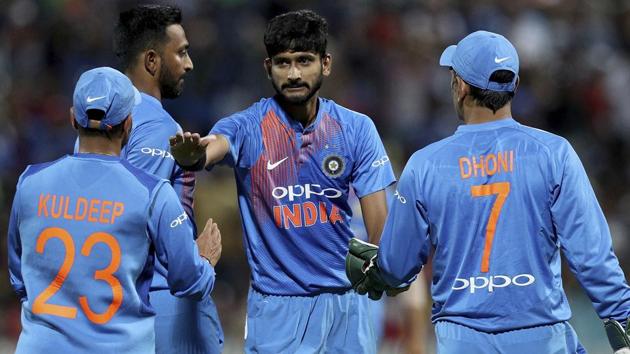 India's Khaleel Ahmed, center, congratulates Kuldeep Yadav on taking the wicket of New Zealand's Kane Williamson. (AP)