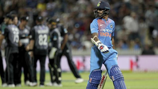 India's Shikhar Dhawan leaves the field after being caught by New Zealand's Daryl Mitchell. (AP)