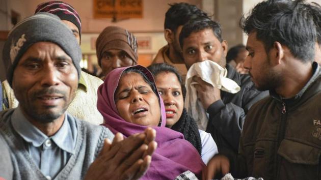 Family members of victims who are undergoing treatment on being poisoned after consuming a spurious liquor, at a hospital in Saharanpur. (PTI) Family members of victims who are undergoing treatment on being poisoned after consuming a spurious liquor, at a hospital in Saharanpur. (PTI)