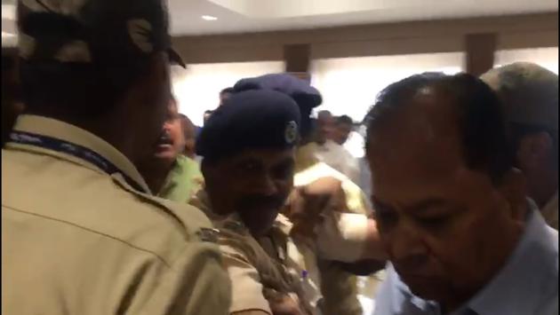 Rajendra Nimbalkar (Right), Pune additional municipal commissioner, was escorted out of the mayor’s office after the attack on Monday. (HT/PHOTO) Rajendra Nimbalkar (Right), Pune additional municipal commissioner, was escorted out of the mayor’s office after the attack on Monday. (HT/PHOTO)