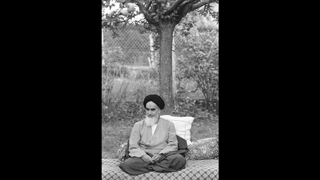 Ayatollah Khomeini in his garden in Neauphle-Le-Château, near Paris, a few months before his triumphal return to Iran. From Paris, The Ayatollah called for resistance against the “illegal” military government. With the government in turmoil, anti-Americanism intensified sparking an exodus that reduced the number of Americans from 45,000 to 12,000 by January. (Joel Robine / AFP File) Ayatollah Khomeini in his garden in Neauphle-Le-Château, near Paris, a few months before his triumphal return to Iran. From Paris, The Ayatollah called for resistance against the “illegal” military government. With the government in turmoil, anti-Americanism intensified sparking an exodus that reduced the number of Americans from 45,000 to 12,000 by January. (Joel Robine / AFP File)