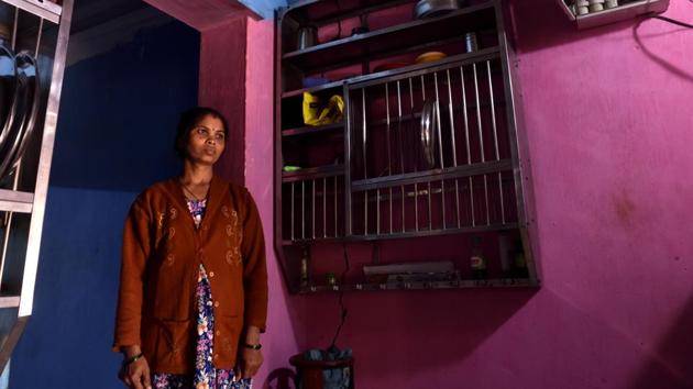 Surekha Raut, who lives in Patkarpada, Talasari, stands against a deep crack on her kitchen wall. The NCS has set up three seismographs in the two talukas. Sixteen of the 1,000 earthquakes measured above three on the scale, which affected more than 30,000 people from 17 villages and damaged at least 1,300 homes. The biggest tremor was recorded on February 1, at 3.6 magnitude. (Anshuman Poyrekar / HT Photo)