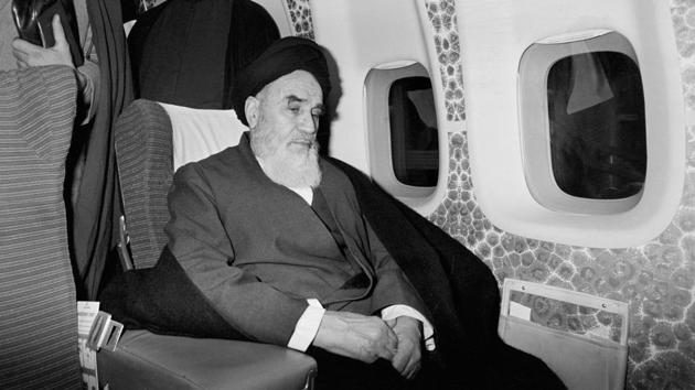 Ayatollah Ruhollah Khomeini inside an airplane in Paris before flying back to Iran after 14 years of exile. Iran entered October 1978 with strikes by civil servants nationwide. Khomeini was forced to leave Iraq for France where he had lived in exile since a failed revolt against the 1963 land reform that deprived the clergy of land holdings. (Thierry Campion / AP File) Ayatollah Ruhollah Khomeini inside an airplane in Paris before flying back to Iran after 14 years of exile. Iran entered October 1978 with strikes by civil servants nationwide. Khomeini was forced to leave Iraq for France where he had lived in exile since a failed revolt against the 1963 land reform that deprived the clergy of land holdings. (Thierry Campion / AP File)