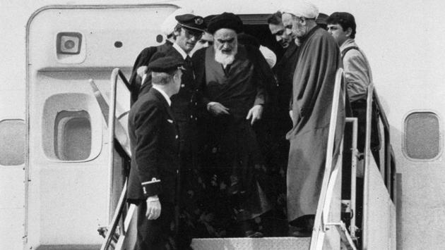 Ayatollah Ruhollah Khomeini emerges from a chartered Air France, accompanied by supporters and 120 international journalists as a measure against threats, upon his arrival at Mehrabad airport in Tehran, Iran on February 01, 1979. (FY / AP File) Ayatollah Ruhollah Khomeini emerges from a chartered Air France, accompanied by supporters and 120 international journalists as a measure against threats, upon his arrival at Mehrabad airport in Tehran, Iran on February 01, 1979. (FY / AP File)