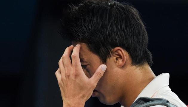 Japan's Kei Nishikori leaves the court after he retired injured during his men's singles quarter-final match against Serbia's Novak Djokovic(AFP) Japan's Kei Nishikori leaves the court after he retired injured during his men's singles quarter-final match against Serbia's Novak Djokovic(AFP)