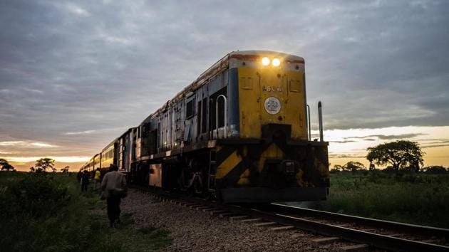 A commuter train known as the ‘Freedom Train’ approaches a station early morning in Cowdray Park township, in Bulawayo, Zimbabwe. Chugging through townships, maize fields and scrubland as the sun rises, Zimbabwe’s only commuter train is cheap and reliable -- two qualities that its passengers cherish in a downwards-spiralling economy. (Zinyange Auntony / AFP)
