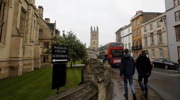 People walk around Oxford University's campus in Oxford, England. Image for representation.(AP file photo)