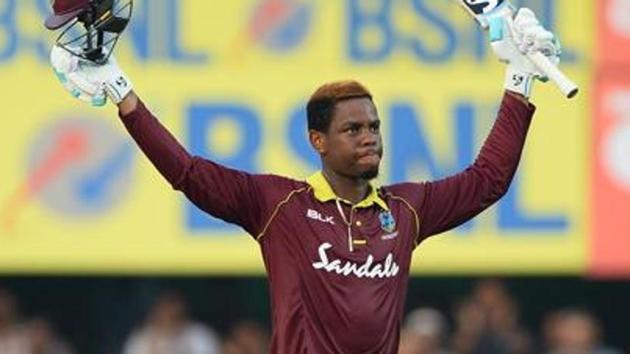 Shimron Hetmyer raises his bat and helmet after he completed his century. (AFP) Shimron Hetmyer raises his bat and helmet after he completed his century. (AFP)