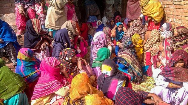 Family members mourn the death of victims who were poisoned after consuming a spurious liquor, in Saharanpur on February 9. (PTI Photo) Family members mourn the death of victims who were poisoned after consuming a spurious liquor, in Saharanpur on February 9. (PTI Photo)