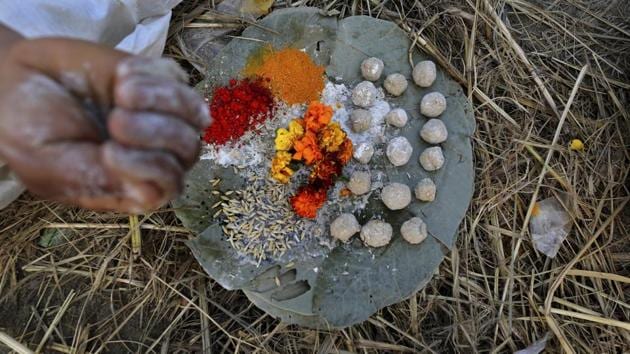 A Hindu man performs rituals before becoming a Naga Sadhu. The aspirants have to take a vow of celibacy, practice tough physical and mental conditioning and renounce worldly possessions and family ties. (Rajesh Kumar Singh / AP)