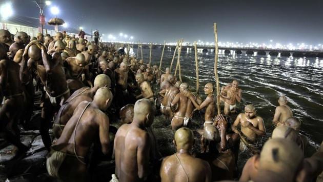 Hindu men take a dip for becoming Naga Sadhus. Usually the ritual is performed only after a person dies. But the last “Pind Dan” at the Naga initiation ceremony is for the sadhu himself, symbolizing the unity of his soul with God. (Rajesh Kumar Singh / AP)