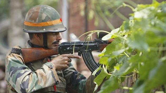 An army soldier holds an AK-47 assault rifle during a fight. (AP File Photo/Representative image) An army soldier holds an AK-47 assault rifle during a fight. (AP File Photo/Representative image)