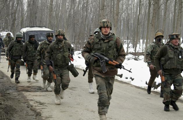 Army soldiers move towards the house where militants were hiding during an encounter in Ratnipora area of Pulwama district of south Kashmir on February 12. (PTI Photo) Army soldiers move towards the house where militants were hiding during an encounter in Ratnipora area of Pulwama district of south Kashmir on February 12. (PTI Photo)