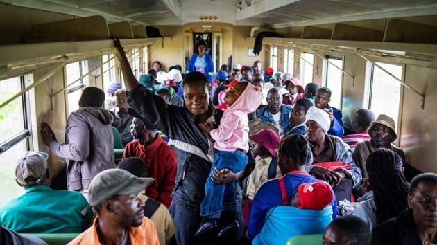 “The prices for kombis (minibuses) went up to two dollars, and that’s just too expensive,” said Sipeka Mushoma, 61, a heavy vehicle driver who managed to grab a precious early seat. “The train is 50 cents. My children have to get the kombi to go to school, but this saves me a lot of money to buy vegetables and bread. Zimbabweans are hurting badly, some of us are really starving now.” (Zinyange Auntony / AFP)