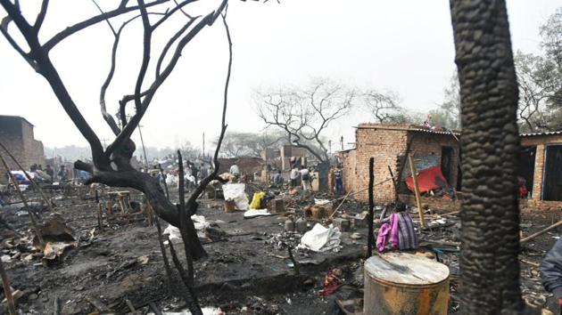 At least 250 huts were gutted in a massive fire which broke out in a slum in Delhi’s Paschim Puri area on Wednesday. The cause of the fire is yet to be ascertained, however, short-circuit is being suspected as the reason behind the massive blaze. 26 water tenders were rushed to the spot and the injured have been shifted to the hospital. (Amal KS / HT Photo) At least 250 huts were gutted in a massive fire which broke out in a slum in Delhi’s Paschim Puri area on Wednesday. The cause of the fire is yet to be ascertained, however, short-circuit is being suspected as the reason behind the massive blaze. 26 water tenders were rushed to the spot and the injured have been shifted to the hospital. (Amal KS / HT Photo)