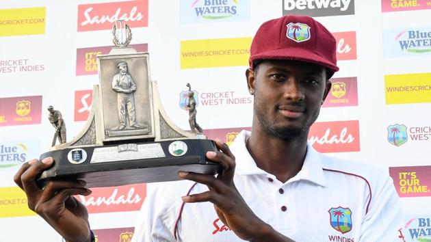 Jason Holder of West Indies holds the Wisden trophy at the end of day 4 of the 3rd and final Test between West Indies and England at Darren Sammy Cricket Ground.(AFP)