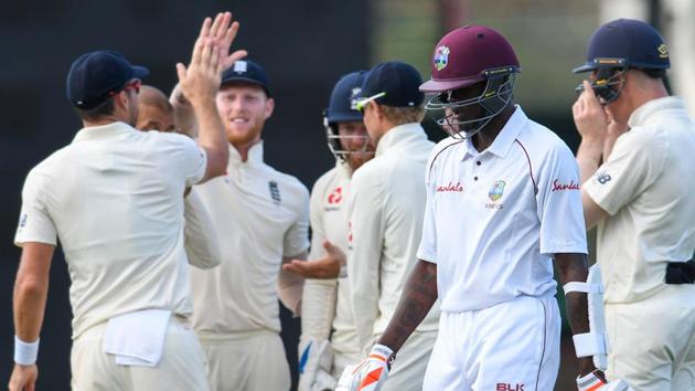 Alzarri Joseph (2R) of West Indies walks off the field as England players celebrate his dismissal during day 4 of the 3rd and final Test between West Indies and England.(AFP)