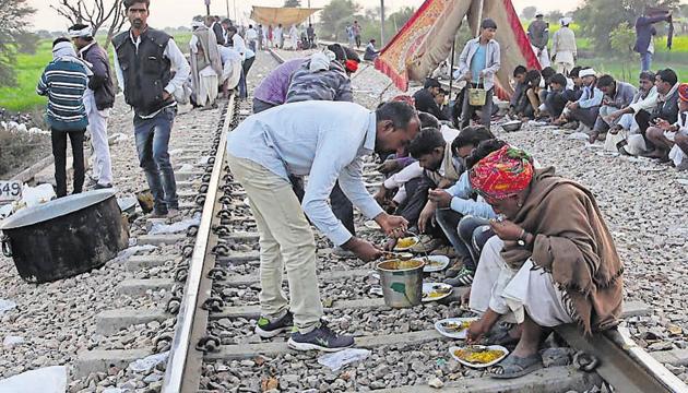 Gujjar protesters, demanding quota in education and jobs, camping on rail tracks at Maksudanpura, near Malarna Dungar railway station, in Sawai madhopur on Monday 11 February 2019.(HImanshu Yyas / HT Photo) Gujjar protesters, demanding quota in education and jobs, camping on rail tracks at Maksudanpura, near Malarna Dungar railway station, in Sawai madhopur on Monday 11 February 2019.(HImanshu Yyas / HT Photo)