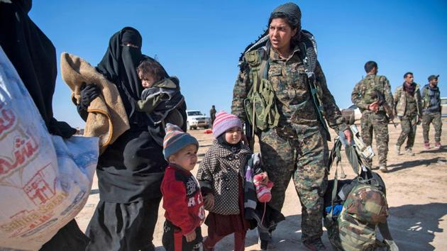 Khadija is one year old, born under IS in the eastern province of Deir Ezzor. She was swaddled in a thick blanket by her mother, a 17-year-old Syrian girl from 500 kilometres away in the northern city of Manbij. Her father, just as young, has been rounded up by the SDF and placed into another truck with dozens of men. (Fadel Senna / AFP) Khadija is one year old, born under IS in the eastern province of Deir Ezzor. She was swaddled in a thick blanket by her mother, a 17-year-old Syrian girl from 500 kilometres away in the northern city of Manbij. Her father, just as young, has been rounded up by the SDF and placed into another truck with dozens of men. (Fadel Senna / AFP)