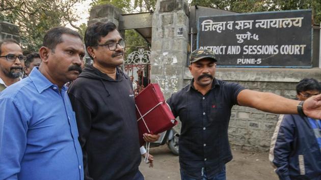 Activist Anand Teltumbde (black pullover) leaves after Pune District and Sessions Court released him in Bhima Koregaon case, in Pune. (PTI) Activist Anand Teltumbde (black pullover) leaves after Pune District and Sessions Court released him in Bhima Koregaon case, in Pune. (PTI)