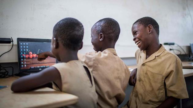 Schoolchildren attend a training session in a container in Avrankou, south of Benin. (AFP) Schoolchildren attend a training session in a container in Avrankou, south of Benin. (AFP)