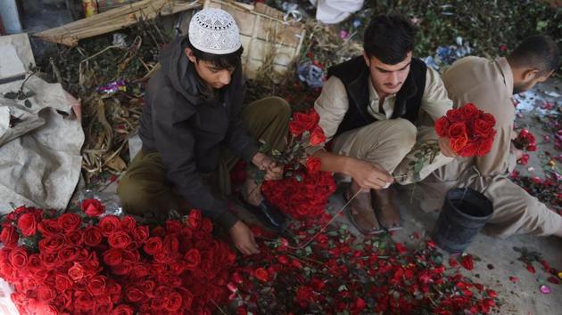 Pakistanis vendors prepare flower bouquets at a roadside stall ahead of Valentine's Day in Karachi on February 13. (AFP Photo) Pakistanis vendors prepare flower bouquets at a roadside stall ahead of Valentine's Day in Karachi on February 13. (AFP Photo)
