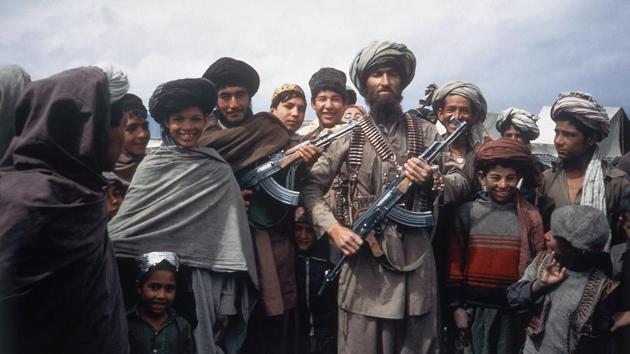 Mujahideen tribesmen at a border camp near Wana in Afghanistan on April 1, 1984. In one example, Kabulov recalled how Soviet advisers stubbornly tried to conduct a socialist-style land reform, distributing tracts that belonged to tribal leaders to farmers, who then turned it back to original owners. Kabulov charged that the US ignored the Soviet lessons in trying to foster the creation of a Western-style democracy. (Christopher Gunness / AP File)