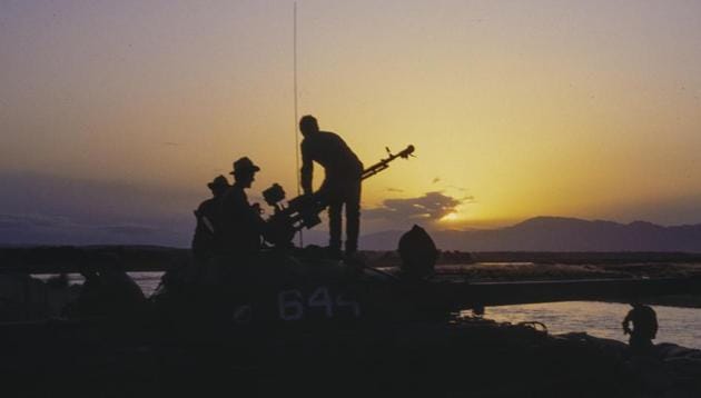 Soviet soldiers stand atop of a tank during sunset in Afghanistan in September 1984. Like Russia’s campaign in Syria, the Afghan war is widely perceived as legitimate action against US-backed militants. And in a twist of history, Russia has emerged as an influential power broker, mediating between Afghan factions and jockeying for influence amid a US-led coalition embroiled for more than 17 years. (Alexander Zemlianichenko / AP File)