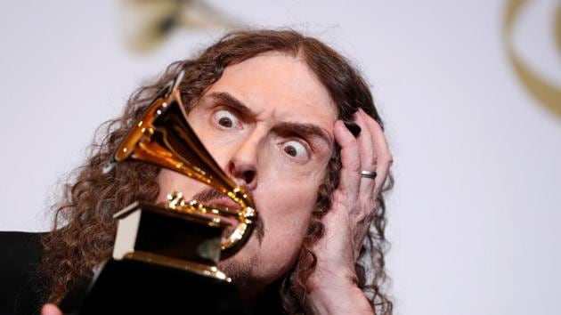 Parodist and comedian “Weird Al” Yankovic poses backstage with the award for best boxed or special limited edition package for “Squeeze Box: The Complete Works of ‘Weird Al’ Yankovic” at the 61st annual Grammy Awards, at the Staples Center, in Los Angeles. (Mario Anzuoni / REUTERS)