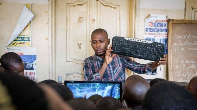 BloLab pays to rent a cab to tow the trailer, which was donated by Swiss-based charity African Puzzle. The classroom, which has visited two communities since last August, stays in one place for a month at a time, providing five two-hour computer skills classes per week, free of charge. (Yanick Folly / AFP) BloLab pays to rent a cab to tow the trailer, which was donated by Swiss-based charity African Puzzle. The classroom, which has visited two communities since last August, stays in one place for a month at a time, providing five two-hour computer skills classes per week, free of charge. (Yanick Folly / AFP)