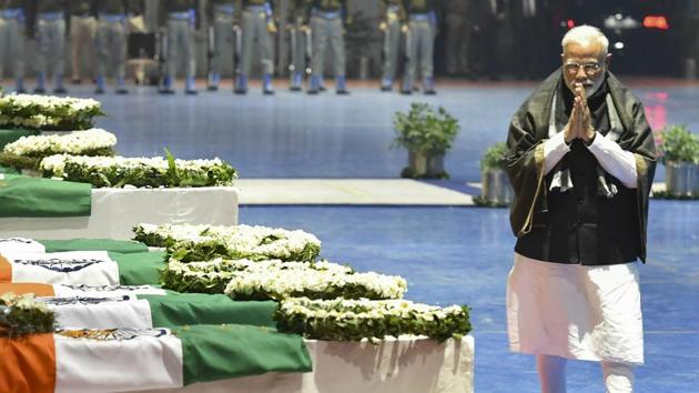 New Delhi: Prime Minister Narendra Modi pays tribute to the martyred CRPF jawans, who lost their lives in Thursday's Pulwama terror attack, after their mortal remains were brought at AFS Palam in New Delhi, Friday, Feb 15, 2019. (PTI Photo/Manvender Vashist) (PTI2_15_2019_000232B) (PTI)