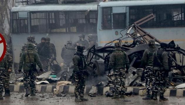 Security men inspect at the site blast in Lethpora area of south Kashmir' s Pulwama district some 20 kilometers from Srinagar on Thursday.(ANI photo) Security men inspect at the site blast in Lethpora area of south Kashmir' s Pulwama district some 20 kilometers from Srinagar on Thursday.(ANI photo)
